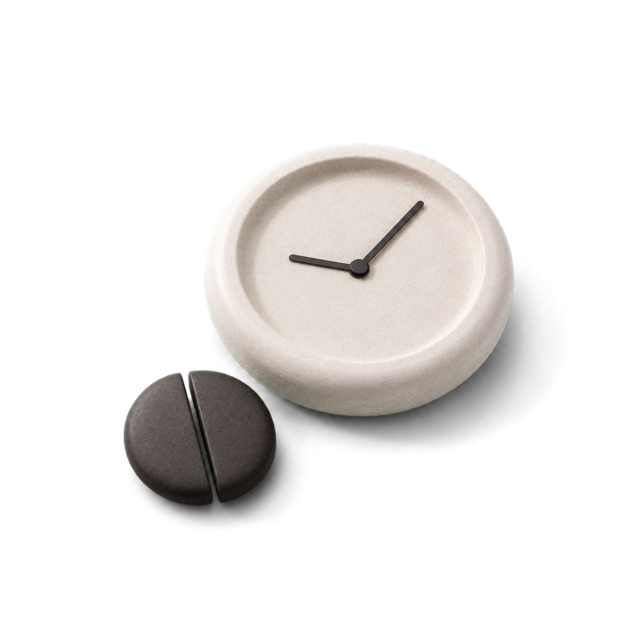 A stone clock beside the split stone