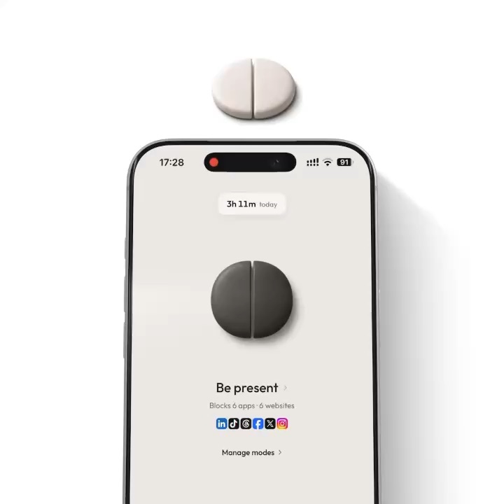 An NFC tag above an iPhone showing the Clank app