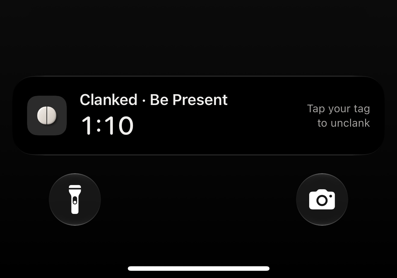 The Lock Screen Live Activity: Clanked, Be Present, 1:10, tap your tag to unclank