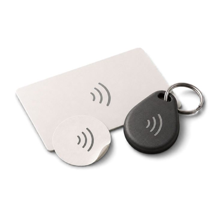 An NFC card, a round sticker and a keychain fob