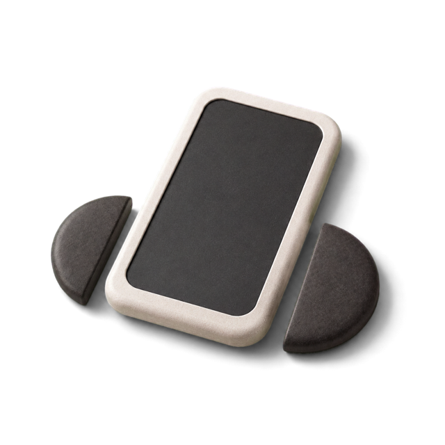 A phone resting between the two stone halves